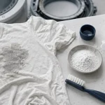 Tache grise sur vêtement après lavage : lessive et tambour à vérifier